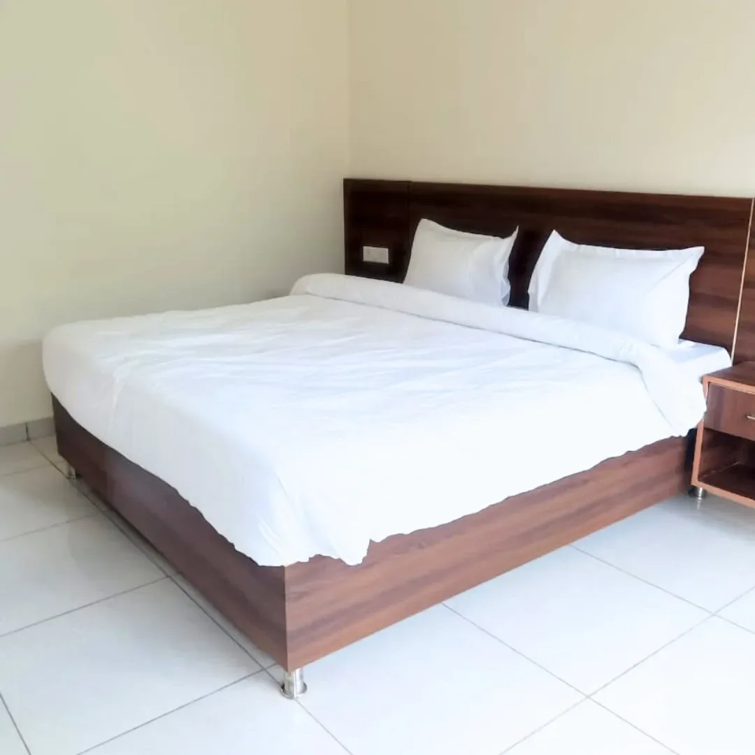 Private student room with attached bathroom and hill view at Om Shanti Om Yoga Ashram, Tapovan.