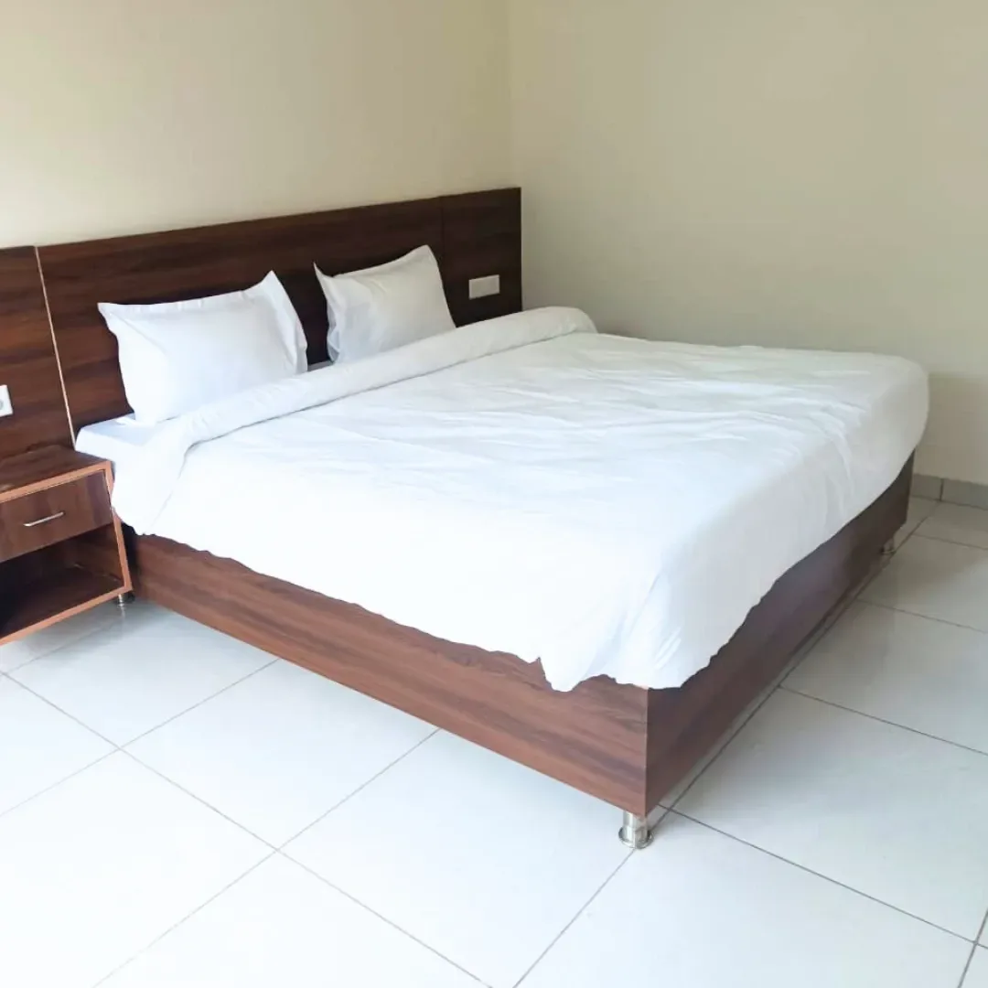 Twin-shared student room for women at the ashram.