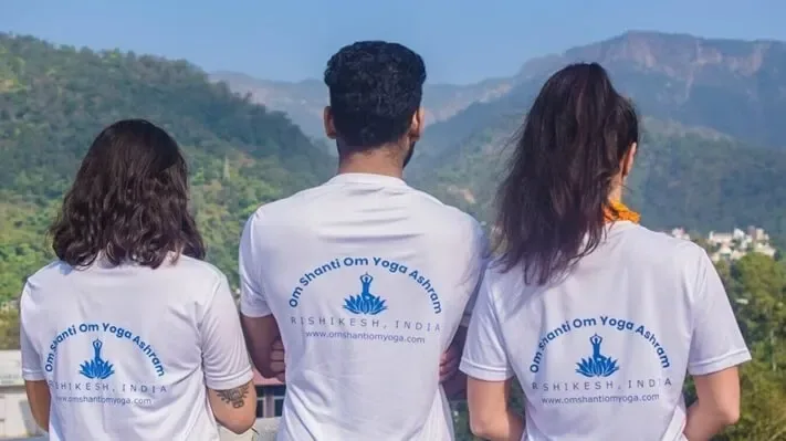Students practising yoga in the training hall at Om Shanti Om, Rishikesh.