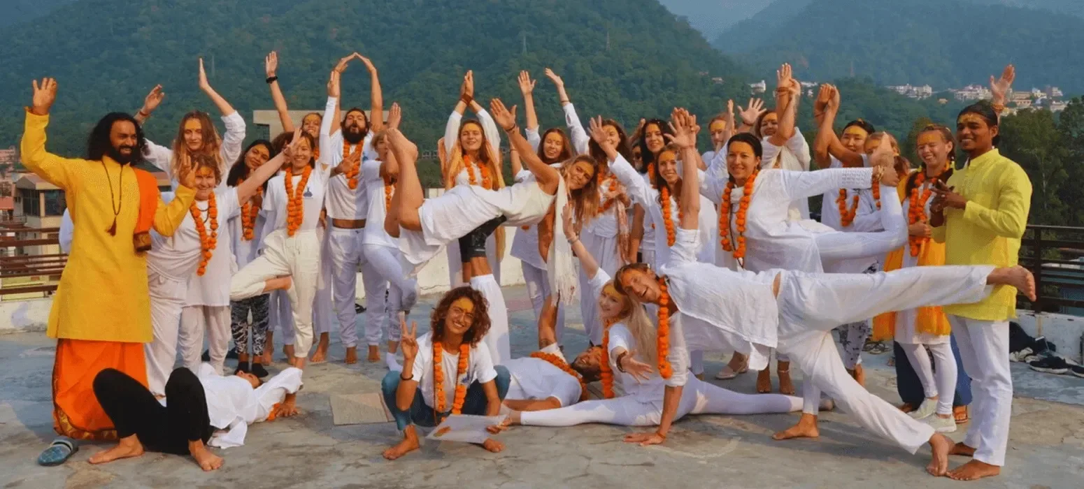 Outdoor yoga practice by the Ganges in Rishikesh.